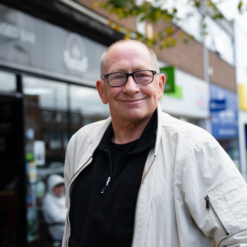 Marcus Rivera, owner of a plumbing company, smiling